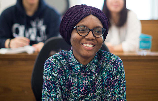 Queen Mary law student sat in a lecture