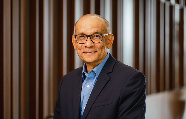 Tony Anghie smiling and wearing glasses.