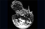 A black and white image of the earth cut in half with an image of a burning oil spill in the top half.