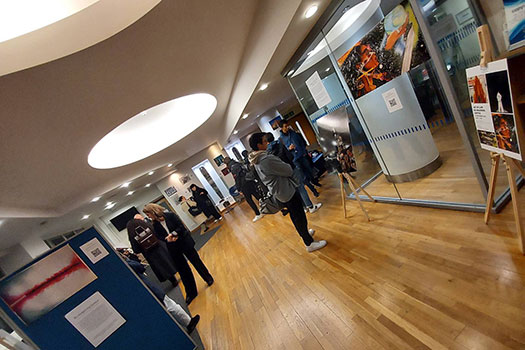 People viewing art at the ‘Re-imagining Justice’ exhibition