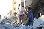 A child in Gaza walking around rubble