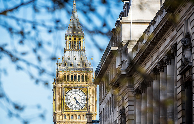 The top of the Big Ben tower with a view of the clock face.