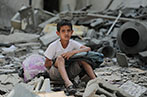 A child in Gaza sitting on the rubble of destroyed buildings.