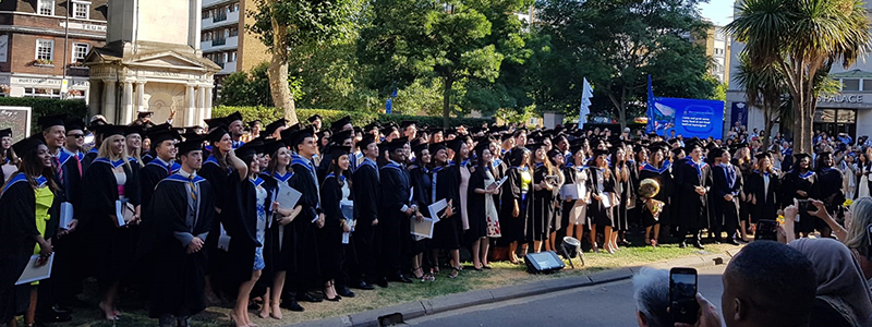 Law graduates outside Queens' Building