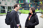 Queen Mary students having a conversation on campus
