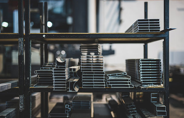 Some steel on a shelf in a warehouse.