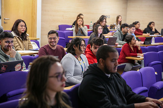 CCLS students sat in a lecture in CCLS's main lecture theatre.