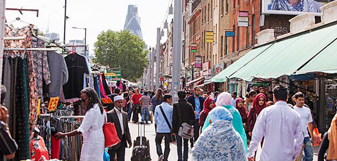 Whitechapel market stalls with The Gherkin in the background
