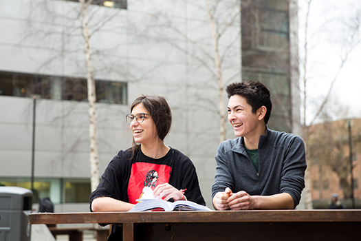 Students sitting at a bench