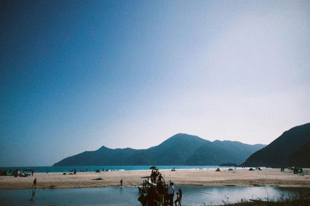 A beach beneath mountains in Tung Ping Chau