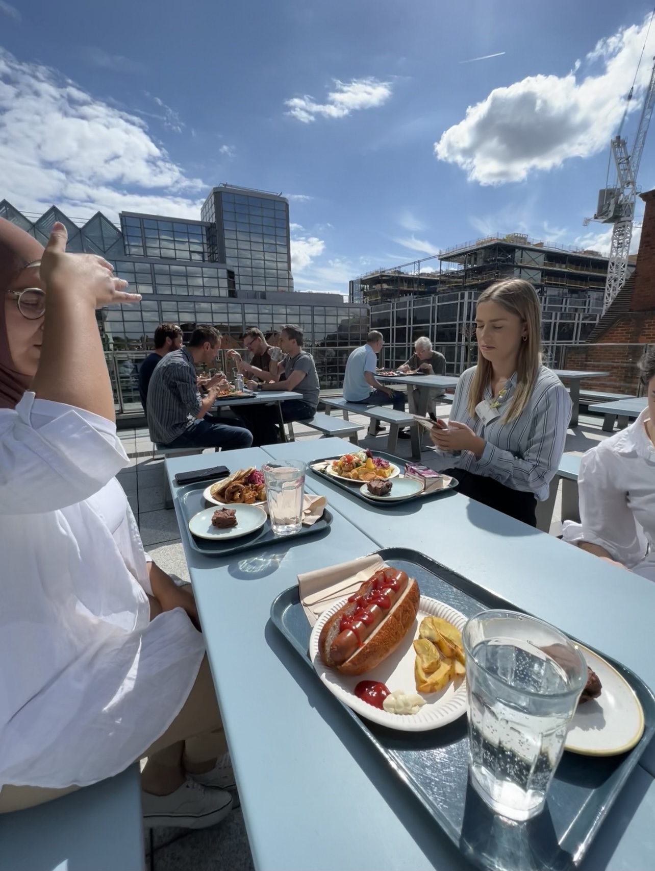 Interns sitting on a terrace at the roof of Google Offices