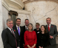 An image of a group of seven men and women standing together for a group picture at Dr Davor Jancic's appointment as an Academic Fellow at the Inner Temple.