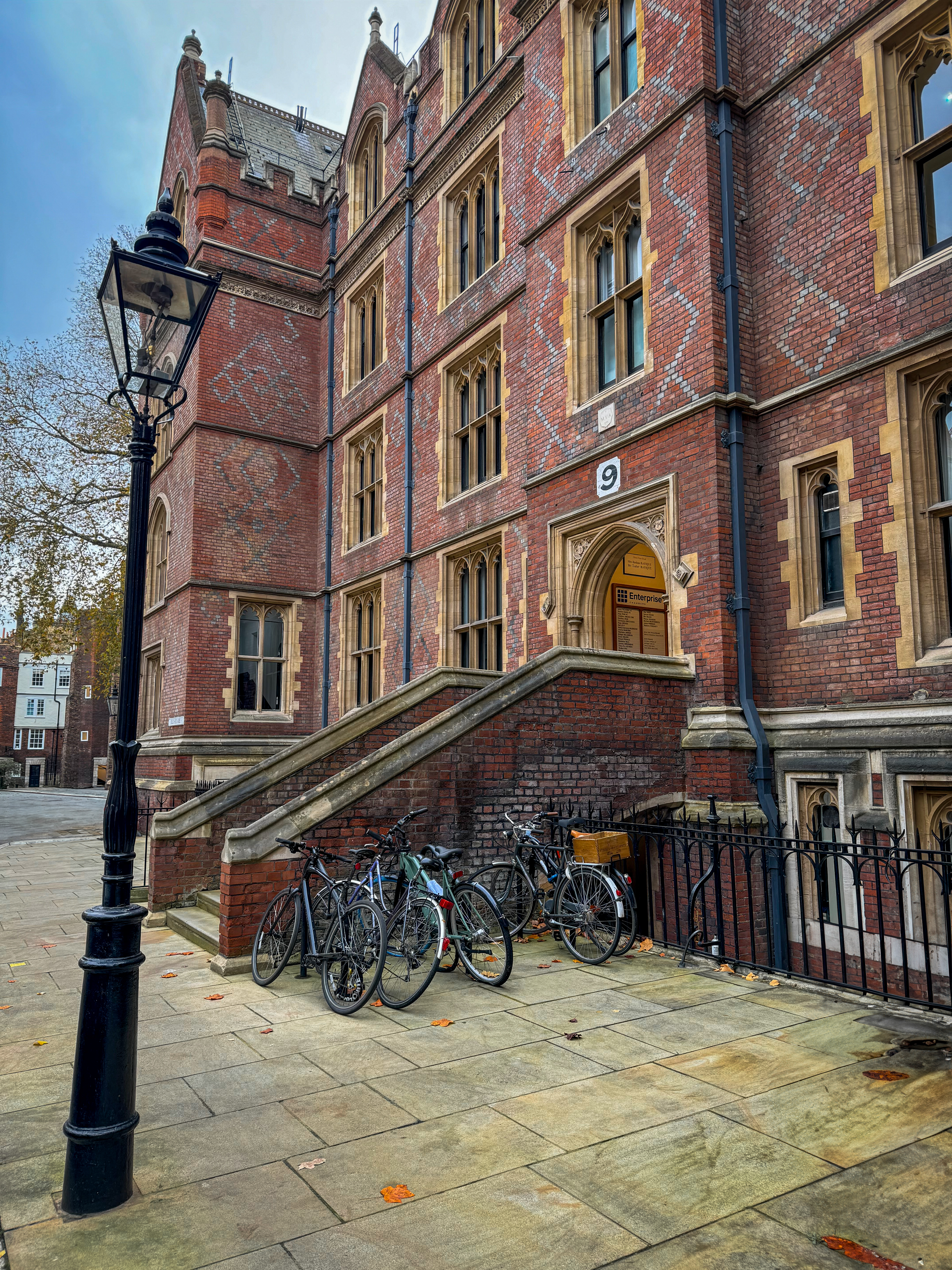 Lincoln's Inn building during autumn with bicycles parked at front