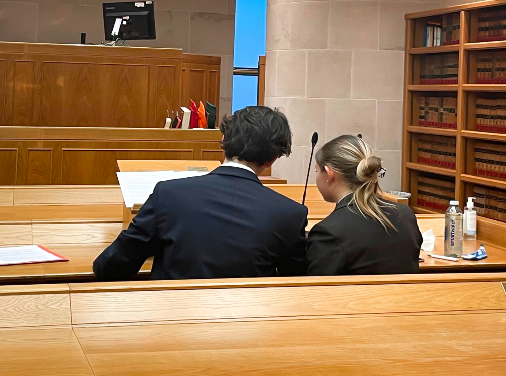 Erwan Morvan and Anna Tikhomirova in moot competition with their backs to the camera