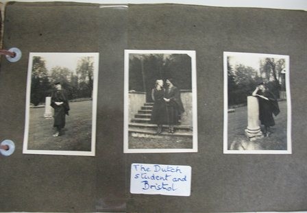 Photograph of a page from a photo album with three black and white photographs of women in various groupings, wearing academic caps and gowns