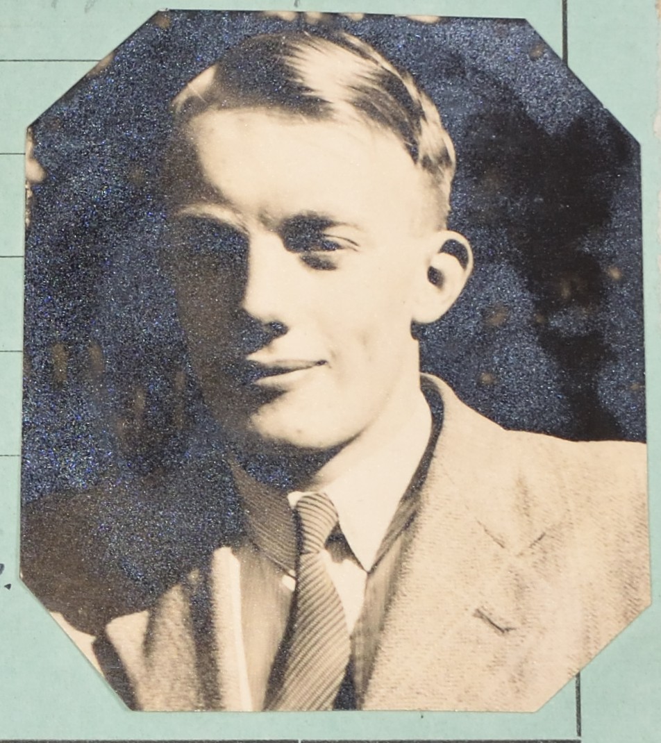 Photograph of young man with blonde hair and a smile