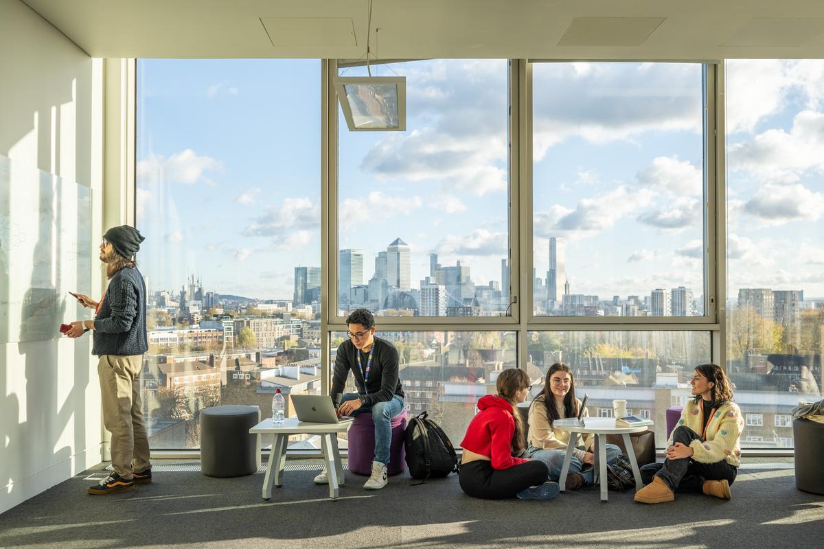 Students working in the Graduate Centre 7th Floor common room