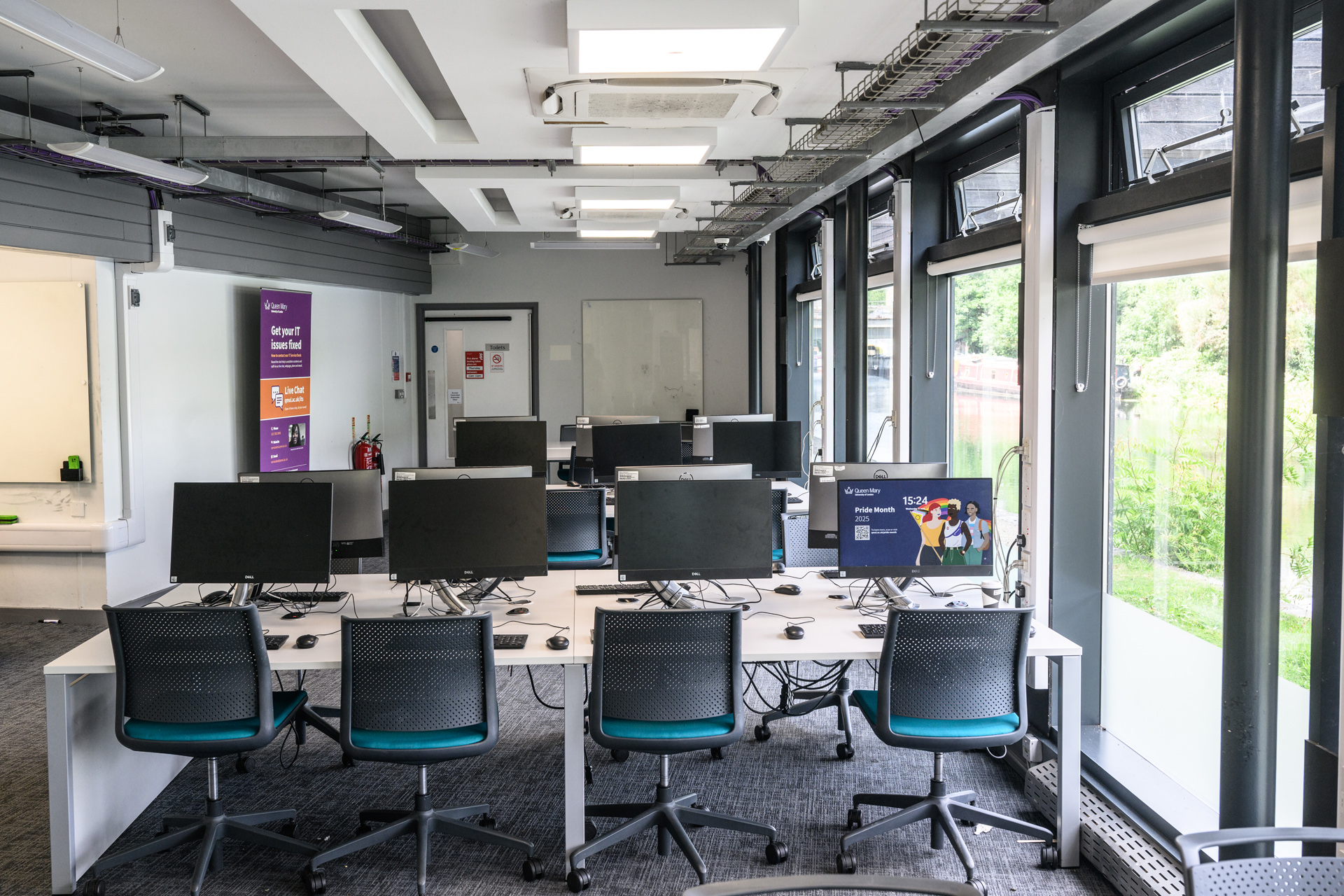 Rows of study desks with PCs