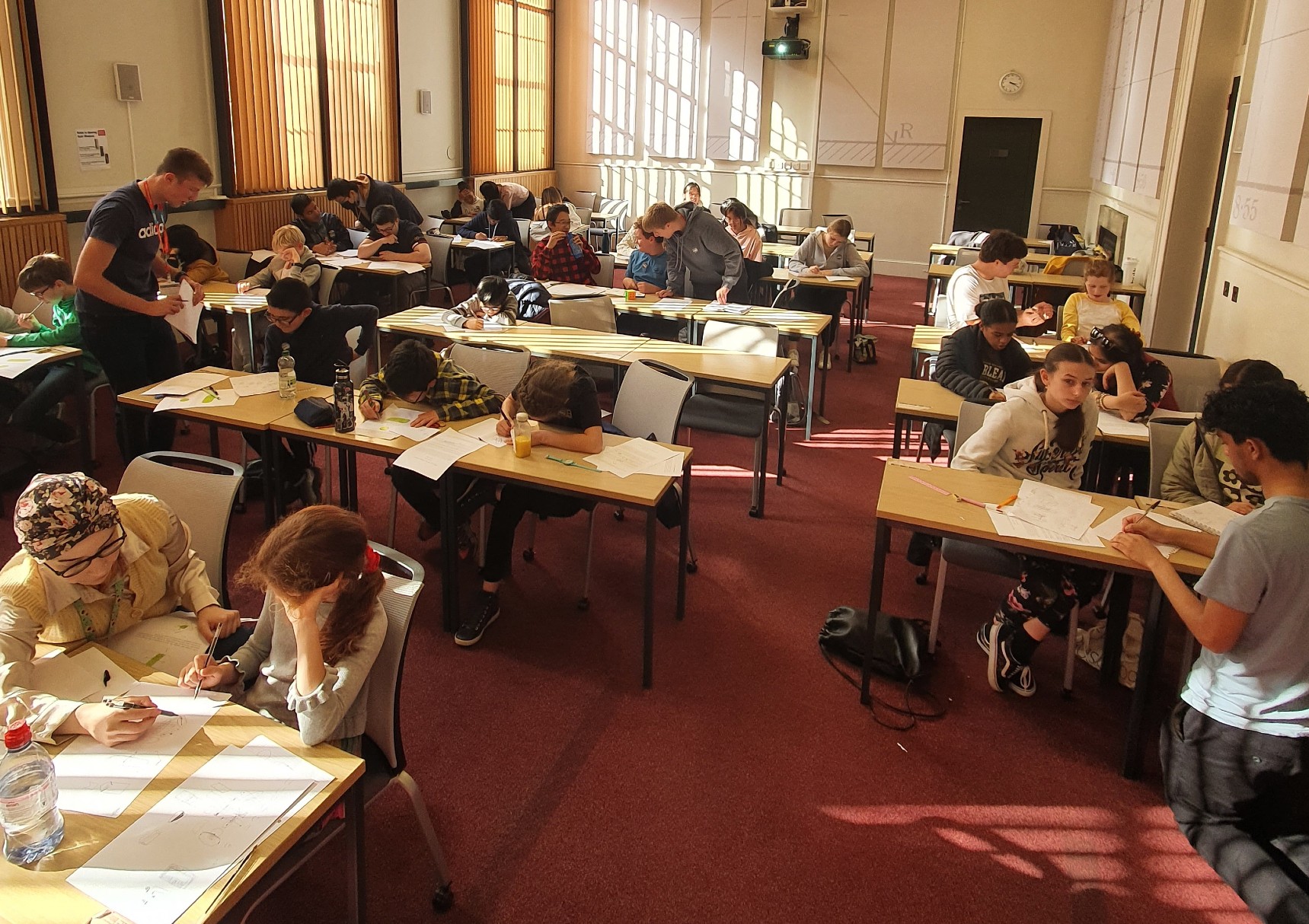 Students and tutors working together at a Maths Circle