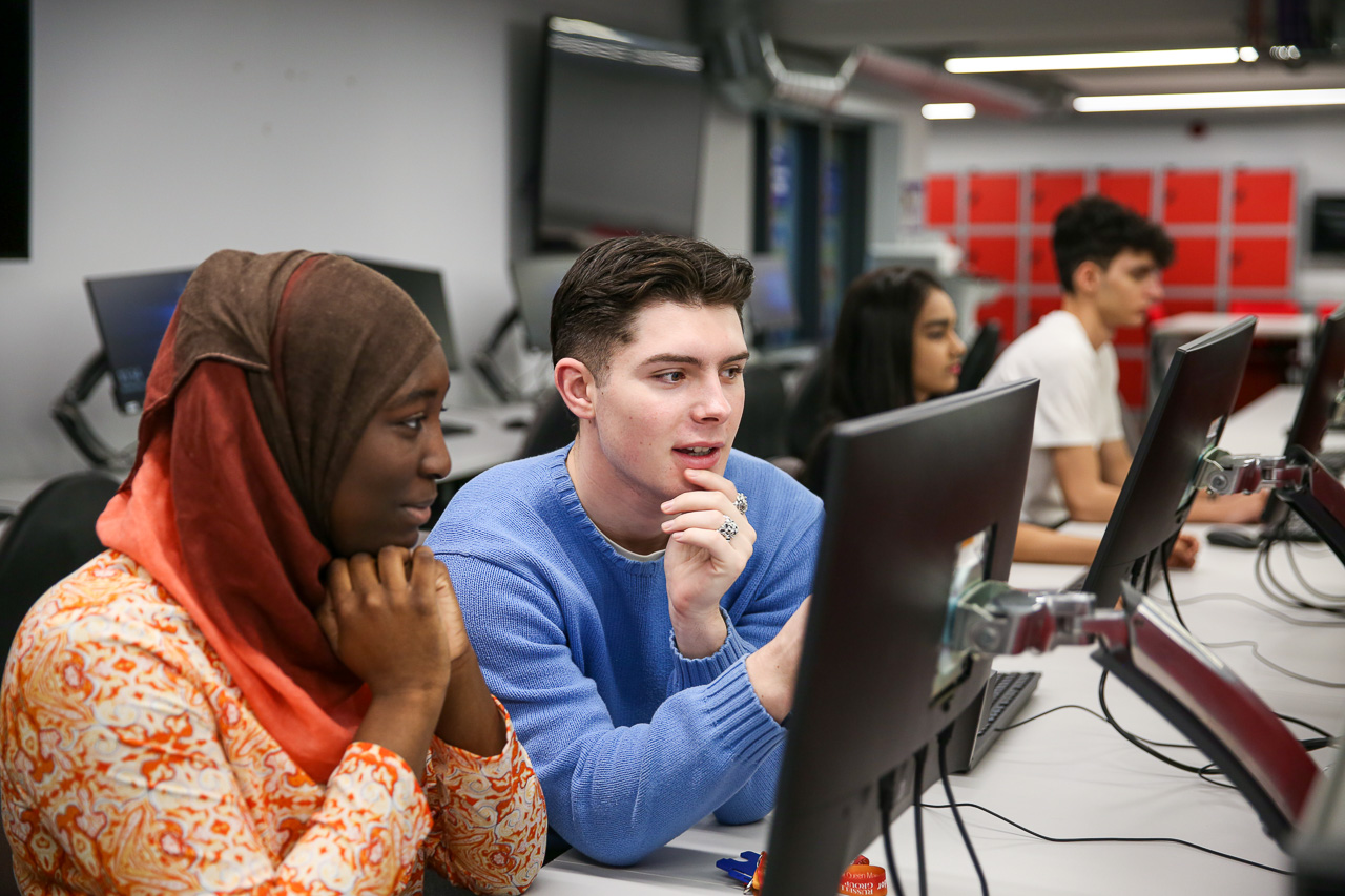 Two students looking at a computer screen