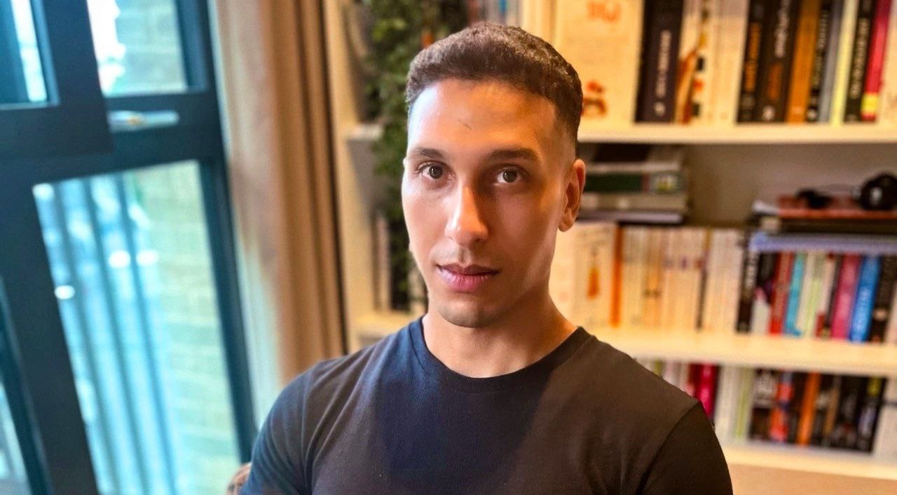 A young man, Mohamed Ejjbair, looking a the camera