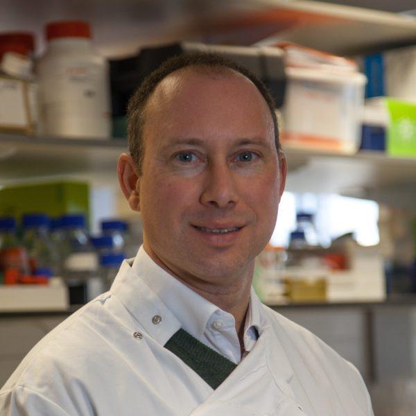 Dr Riches in lab coat