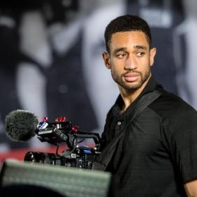 Photo of alumnus, Matt Kay, with a camera