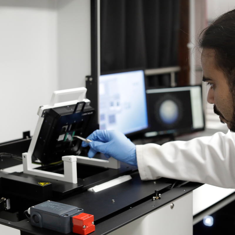A person adjusts equipment in the antenna measurement labratory