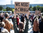 People with placards and posters on global strike for climate change.