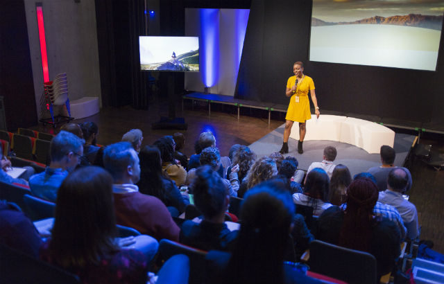 Woman presenting at a conference