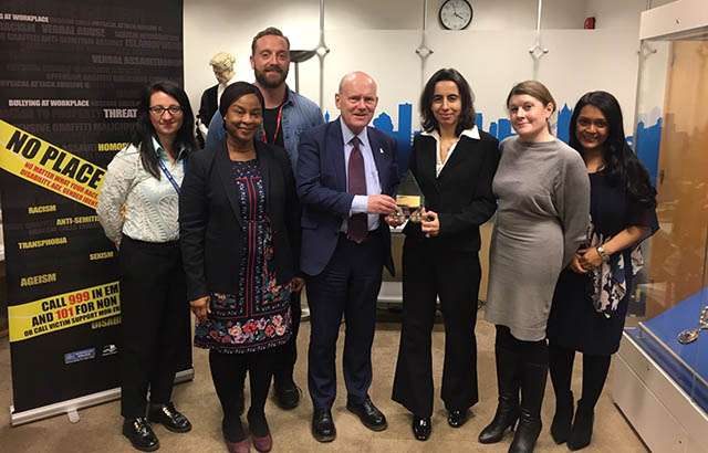 Queen Mary staff receive the trophy from the mayor of Tower Hamlets. Credit: Tower Hamlets
