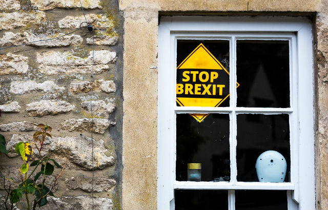 A stop Brexit sign in the window of a village house