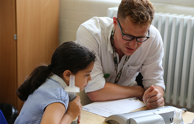 A girl from Netley Primary School has her lung capacity measured
