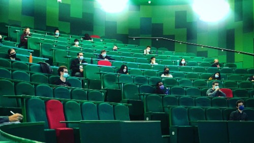 Medical students watch the live feed of Professor Ahmed's surgery rounds from the Perrin Lecture Theatre in Whitechapel