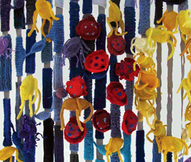 A knitted tableau showing a section of brain, revealing the changes that occur during MS