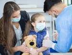 A child receives a vaccination from a doctor. Credit: istock.com/JoannaBoiadjieva