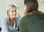 General practitioner reassuring a patient. Credit: iStock.com/AJ_WATT