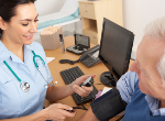 Nurse taking patient's blood pressure. Credit: iStock.com