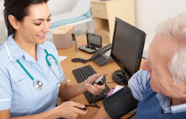Nurse taking patient's blood pressure. Credit: iStock.com