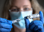 Woman holds Covid-19 vaccine in hands. Credit: scaliger/iStock.com