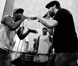 Baba Israel (right) rapping with AfroReggae