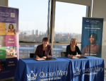 Two people signing MoU between Queen Mary and New City College