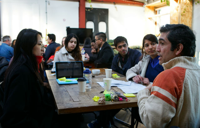 Queen Mary InQUBEate team working with a mentor 