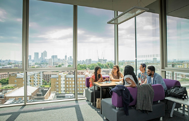 Queen Mary postgraduate students having a conversation. Credit: Queen Mary.