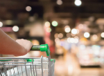 Woman with trolley shopping in a store. Credit: Kwangmoozaa/iStock.com