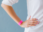 Woman wearing a wristband. Credit: grinvalds/iStock.com
