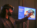 A man demonstrating use of the hololens headset