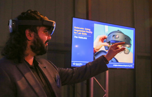 A man demonstrating use of the hololens headset