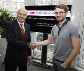 Judge Professor Jim Al-Khalili congratulates Dr Ben Still