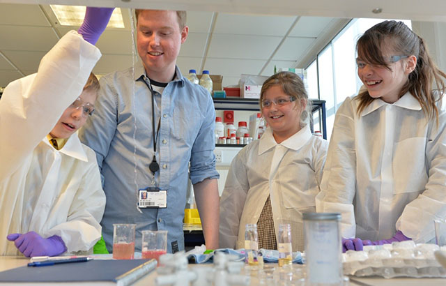 Children learning to make 'worms' with a non-toxic material derived from seaweed that easily changes shape.